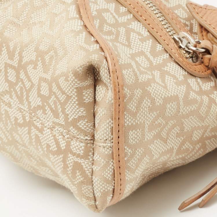 Pre Owned Dkny Beige/Light Green Monogram Canvas and Leather Buckle Baguette Bag 