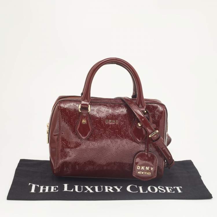 Pre Owned Dkny Dark Red Monogram Embossed Patent Leather Boston Bag