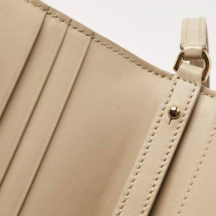 Pre Owned Dolce & Gabbana Beige Patent Leather DG Logo Embossed Clutch Bag