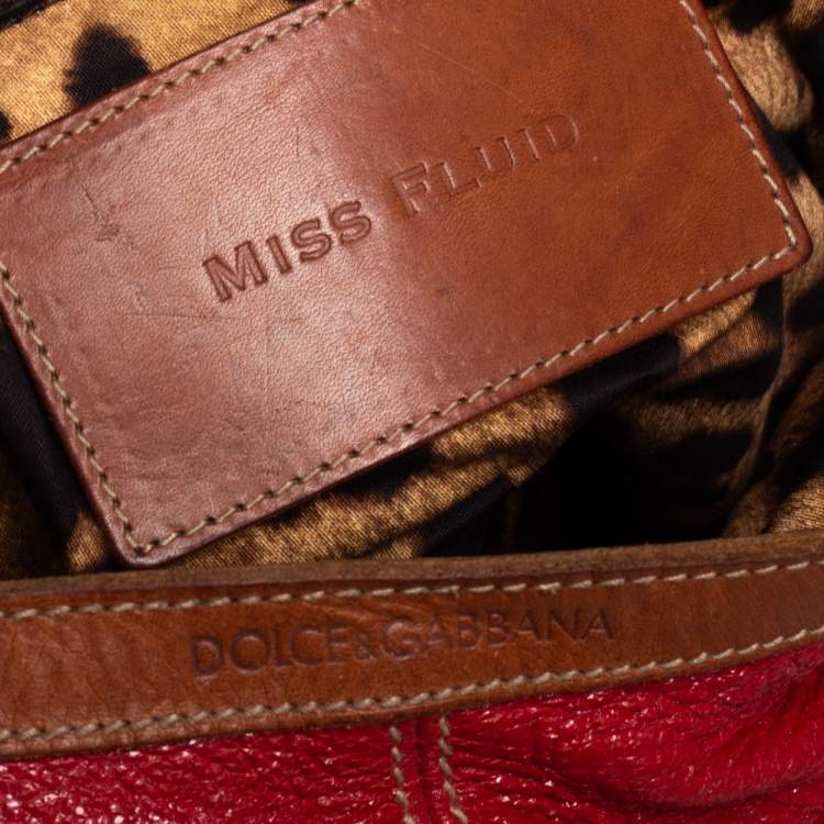 Pre Owned Dolce & Gabbana Red Shimmery Glossy Leather Miss Fluid Hobo