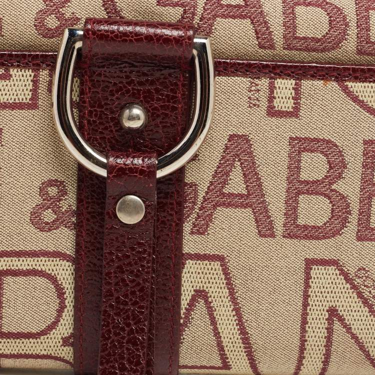 مملوكة مسبقًا Dolce & Gabbana Burgundy Monogram Fabric and Leather D Ring Trifold Wallet