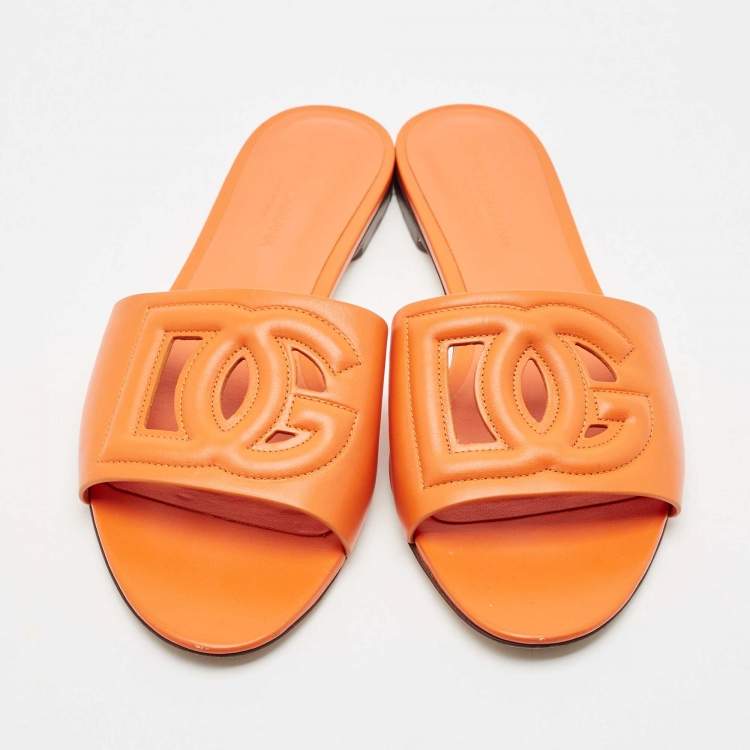 Pre Owned Dolce & Gabbana Orange Leather DG Cut Out Logo Flat Slides Size 39
