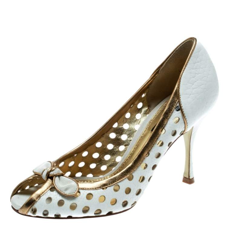 Pre Owned Dolce & Gabbana White/Gold Perforated Leather Bow Detail Peep Toe Pumps Size 36.5