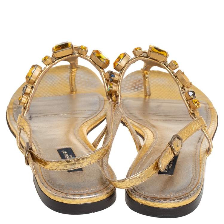 مملوكة مسبقًا Dolce & Gabbana Gold Snakeskin Coin and Crystal Embellished Thong Flats Size 39