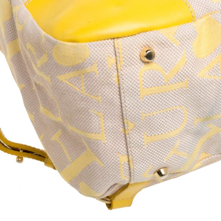 Pre Owned Furla Beige/Yellow Signature Canvas and Leather Flap Backpack