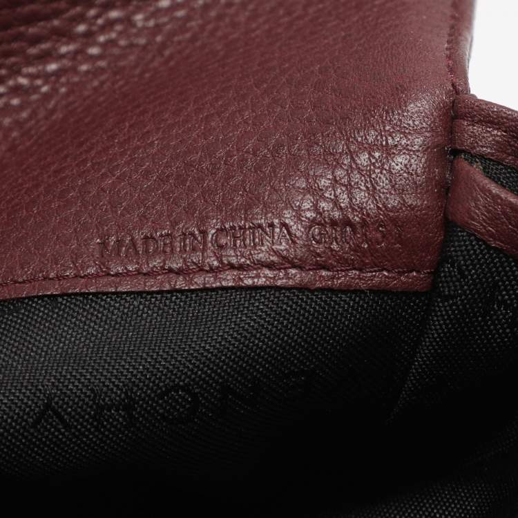 مملوكة مسبقًا محفظة كونتينينتال جيفنشي جلد ونايلون مونوغرامي بورجوندي