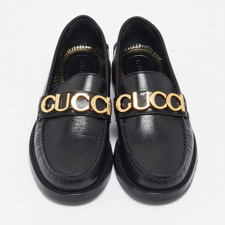 Pre Owned Gucci Black Leather Quentin Logo Plaque Slip On Loafers Size 35