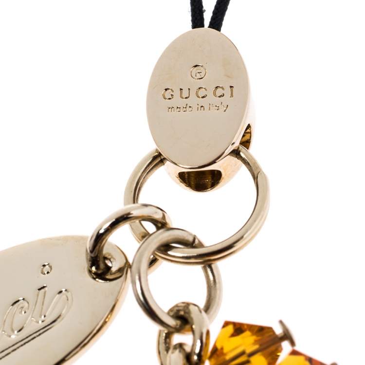 Pre Owned Gucci Logo Enamel Crystal Gold Tone Cell Phone Charm