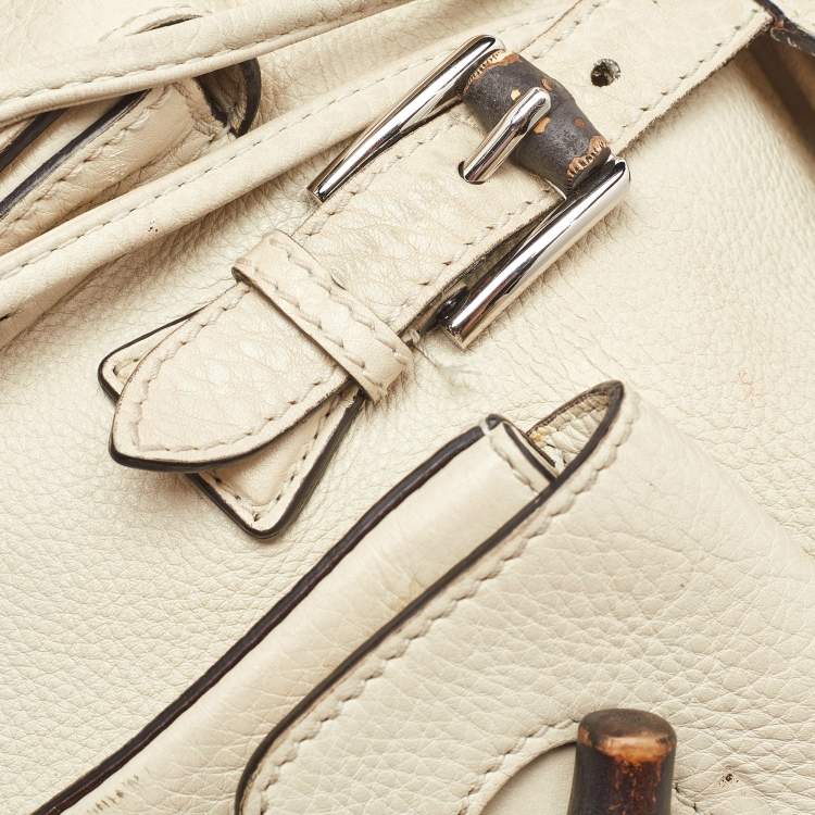 Pre Owned Gucci Off White Pebbled Leather GG Bamboo Tassel Backpack