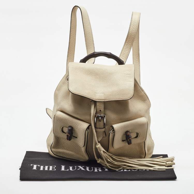 Pre Owned Gucci Off White Pebbled Leather GG Bamboo Tassel Backpack