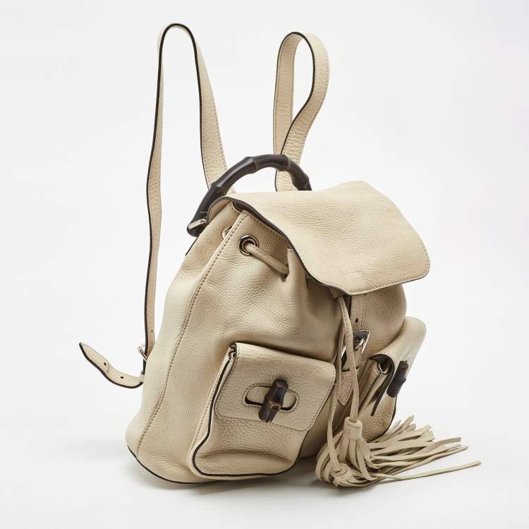 Pre Owned Gucci Off White Pebbled Leather GG Bamboo Tassel Backpack