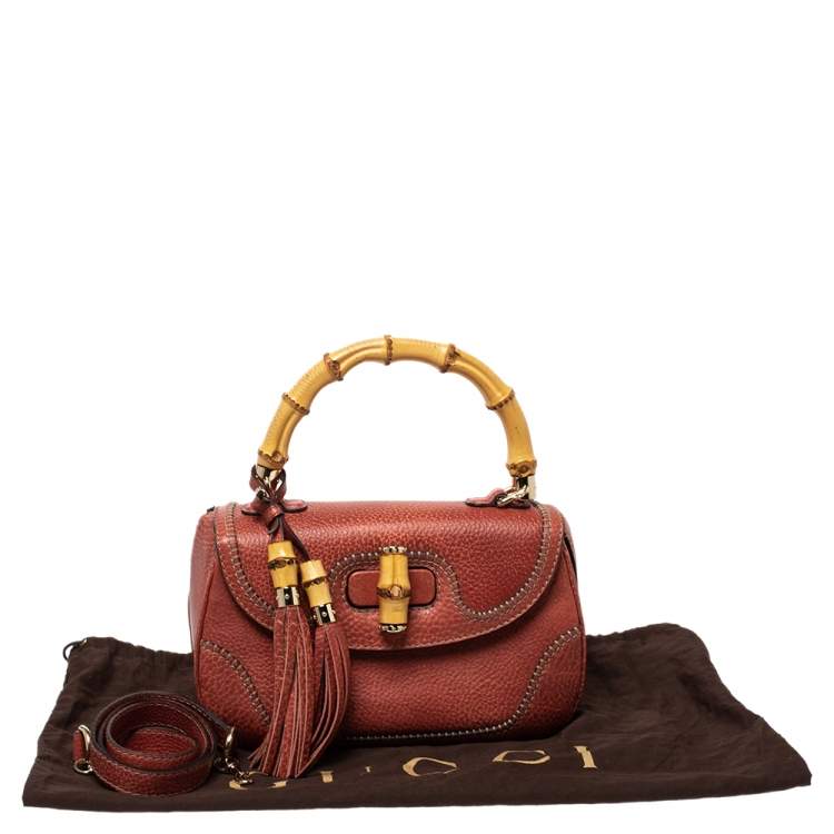 Pre Owned Gucci Dark Orange Grain Leather Tassel New Bamboo Top Handle Bag