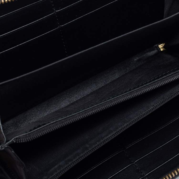 GUCCI Black zip-around wallet in GG Supreme