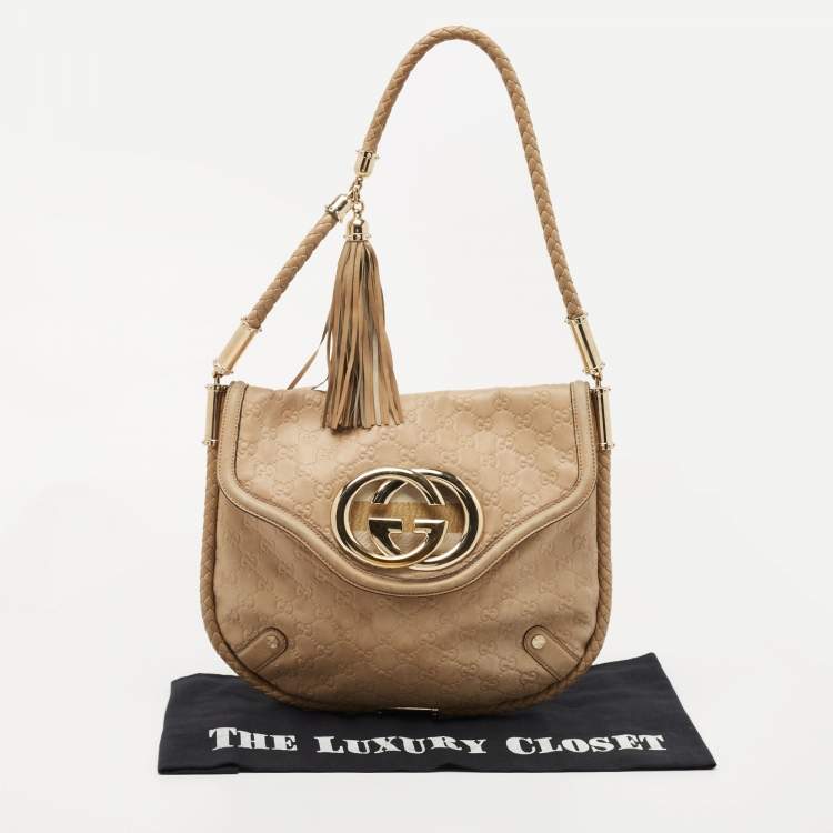 Pre Owned Gucci Beige Guccissima Leather Medium Britt Tassel Hobo