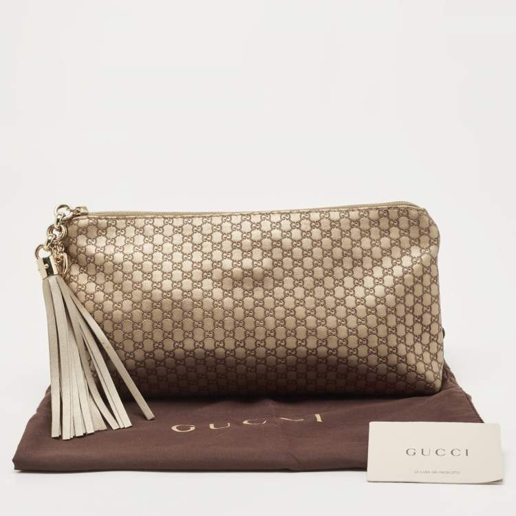 مملوكة مسبقًا Gucci Gold Micro Guccissima Leather Tassel Zip Clutch