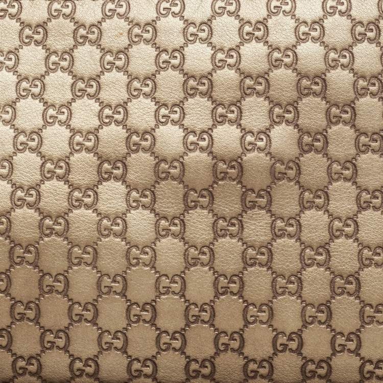 مملوكة مسبقًا Gucci Gold Micro Guccissima Leather Tassel Zip Clutch