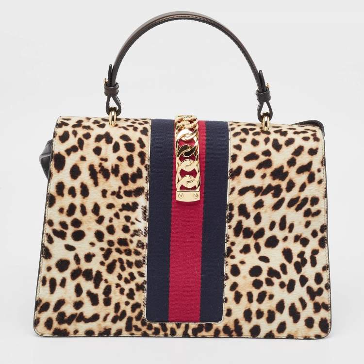 Pre Owned Gucci Beige/Black Leopard Print Calfhair and Leather Medium Sylvie Top Handle Bag