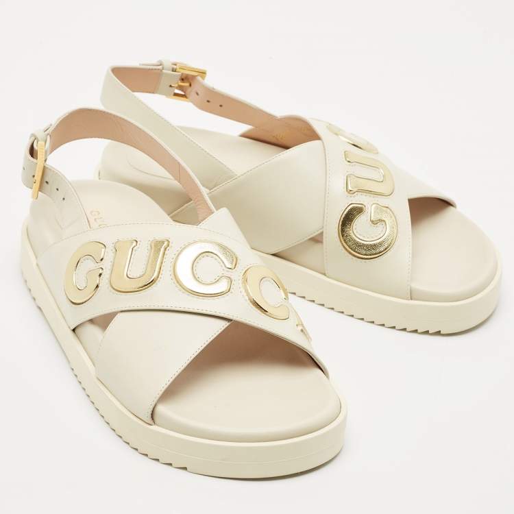 Pre Owned Gucci Off White Leather Logo Ankle Strap Flat Sandals 38.5