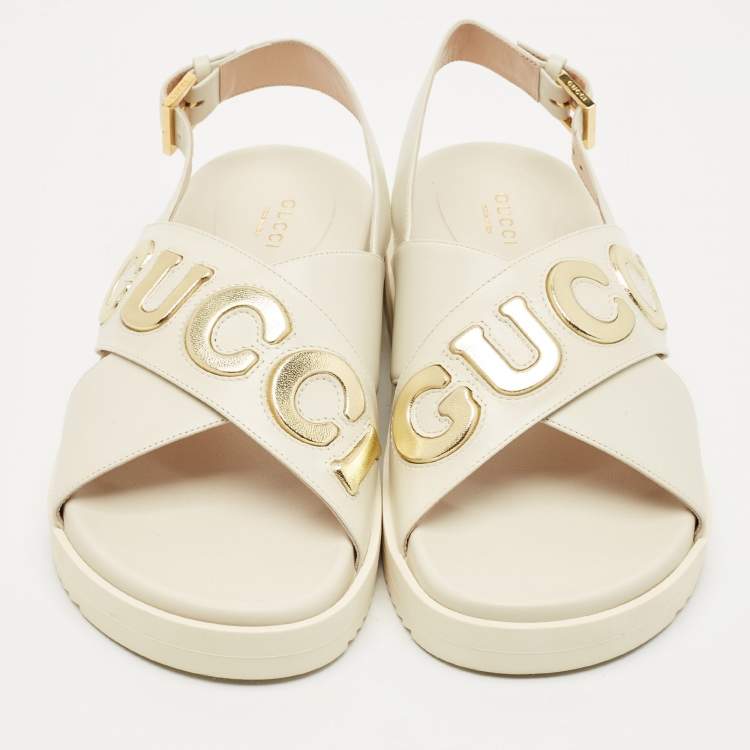 Pre Owned Gucci Off White Leather Logo Ankle Strap Flat Sandals 38.5
