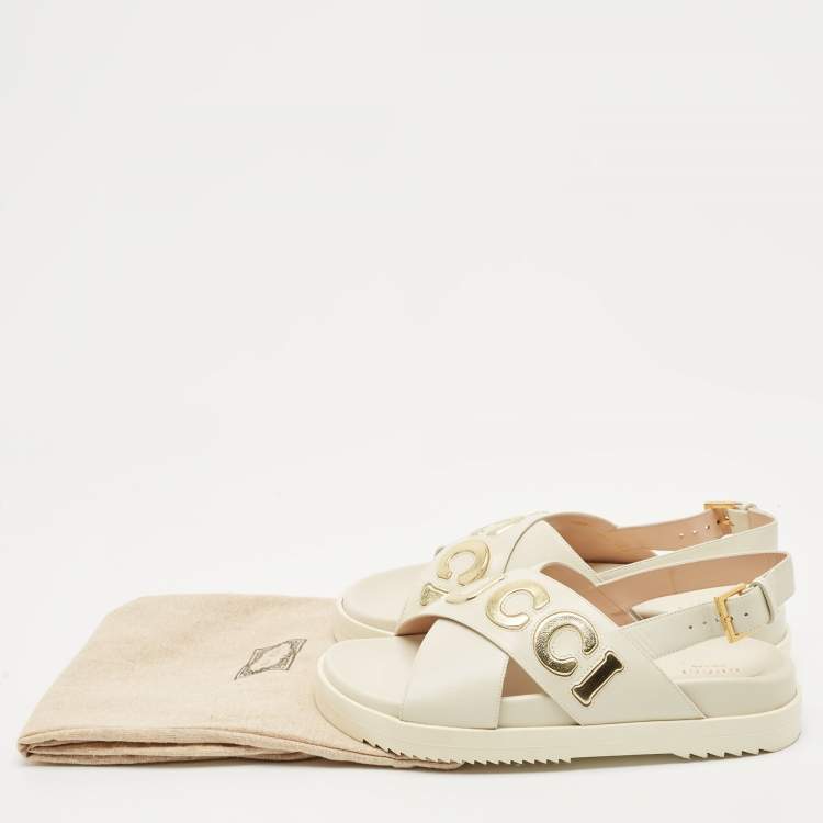 Pre Owned Gucci Off White Leather Logo Ankle Strap Flat Sandals 38.5
