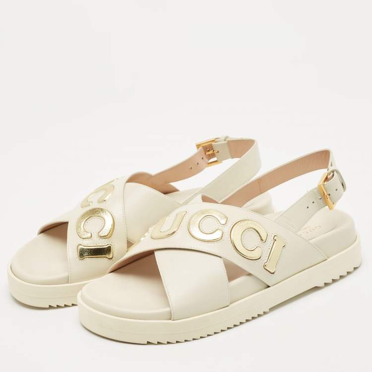 Pre Owned Gucci Off White Leather Logo Ankle Strap Flat Sandals 38.5