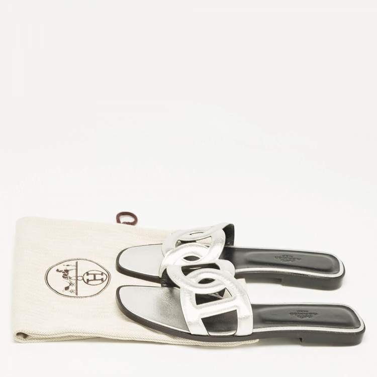 Pre Owned Hermes Silver Leather Omaha Flat Slides Size 39