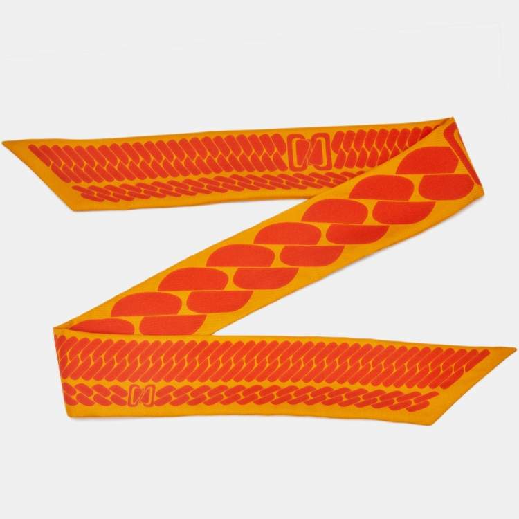 Pre Owned Hermes Yellow/Orange Printed Silk Clic C'est Noue Twilly 