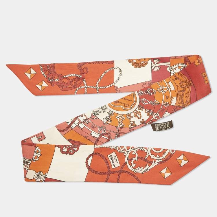 مملوكة مسبقًا Hermes Orange Print Silk Twilly