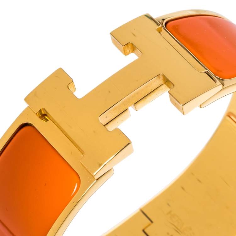 Pre Owned Hermes Clic Clac H Orange Enamel Gold Plated Wide Bracelet PM