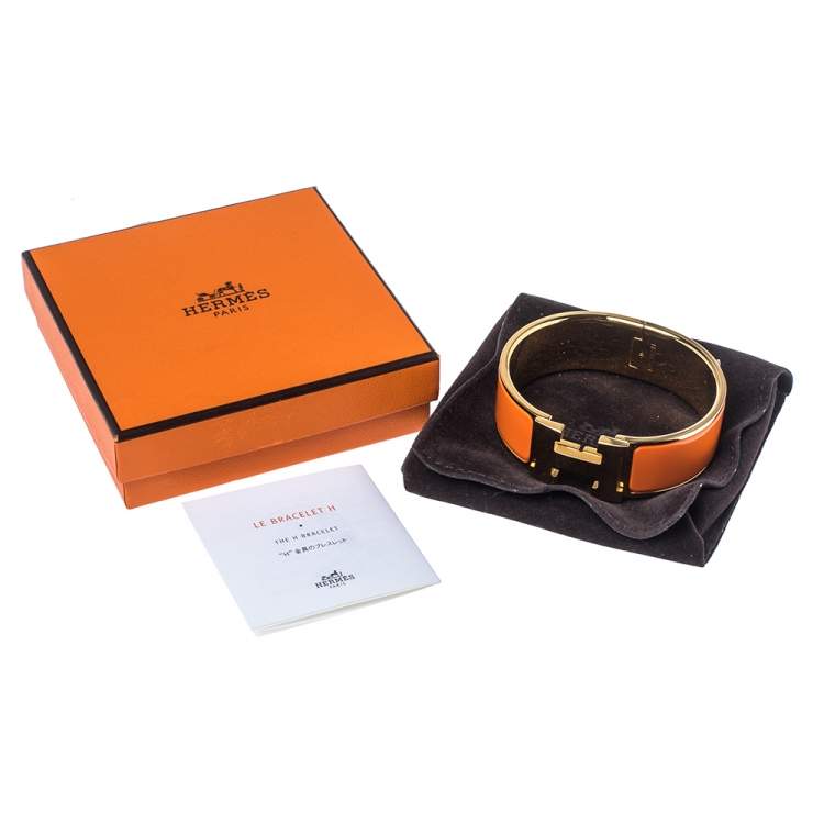 Pre Owned Hermes Clic Clac H Orange Enamel Gold Plated Wide Bracelet PM