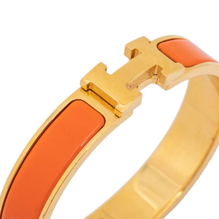 Pre Owned Hermès Clic H Orange Enamel Gold Plated Narrow Bracelet PM