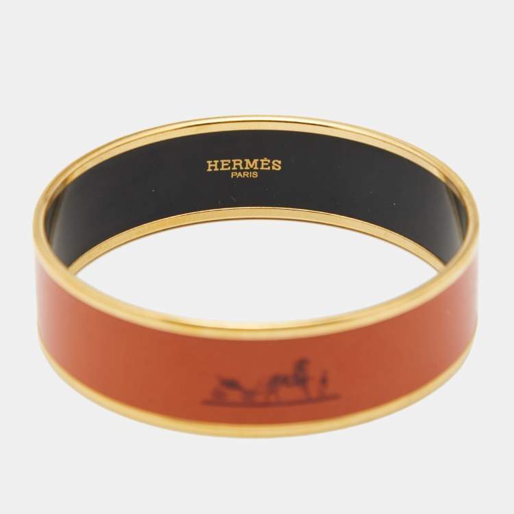 Pre Owned Hermes Wide Orange Enamel Gold Tone Metal Bangle Bracelet