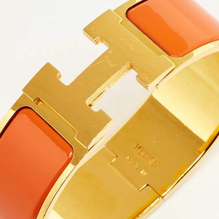 Pre Owned Hermès Clic Clac H Orange Enamel Gold Plated Wide Bracelet 