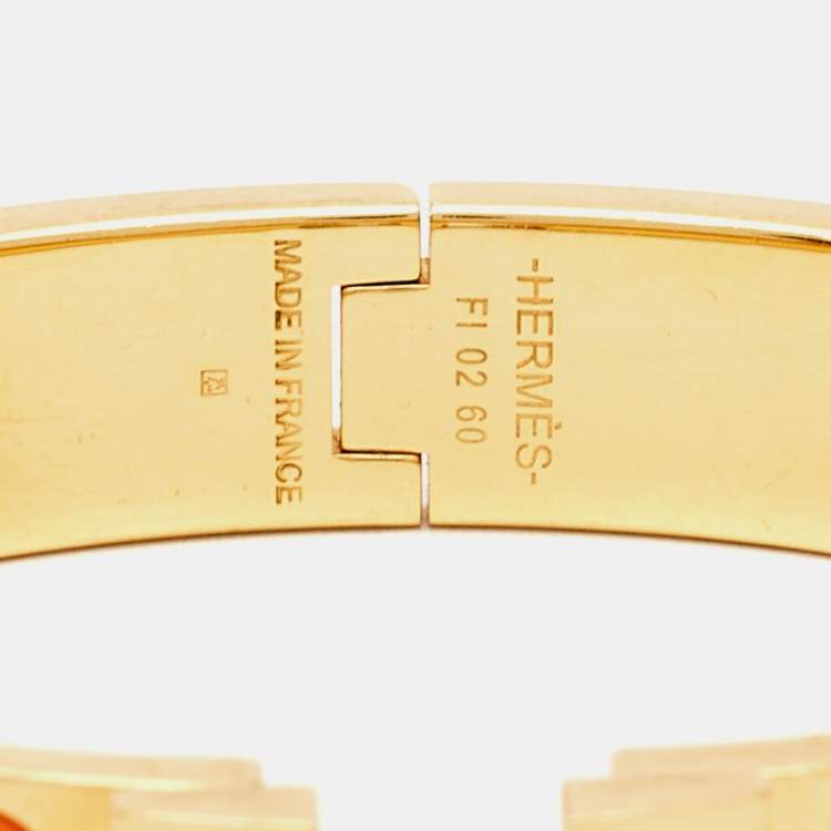 Pre Owned Hermes Clic H Orange Enamel Gold Plated Bracelet