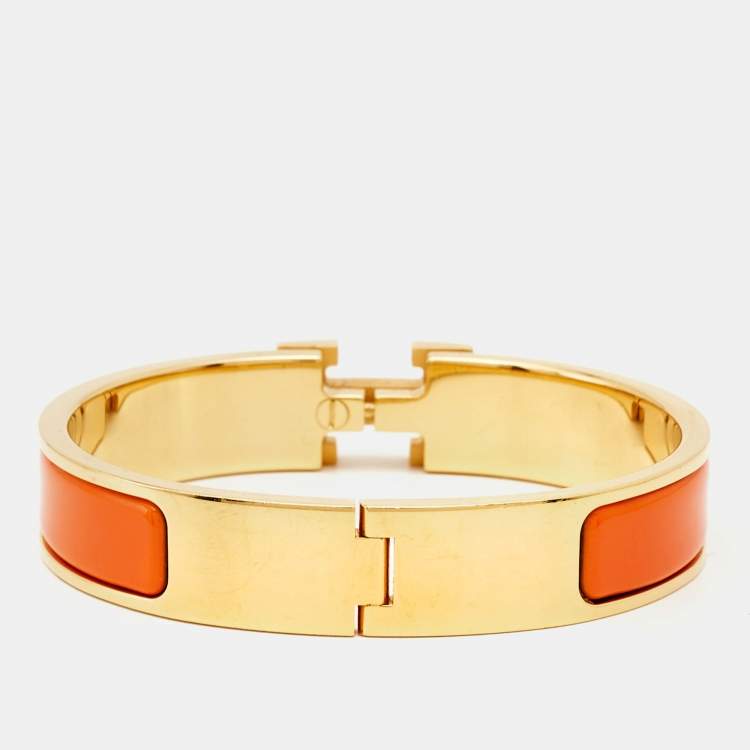 Pre Owned Hermes Clic H Orange Enamel Gold Plated Bracelet