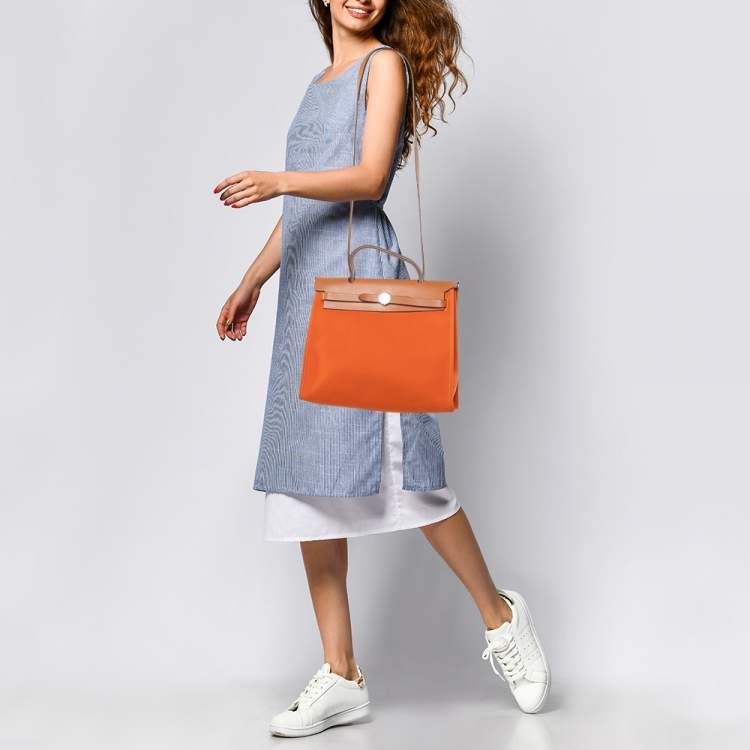 Pre Owned Hermès Orange/Natural Canvas and Vache Hunter Leather Herbag Zip 31 Bag