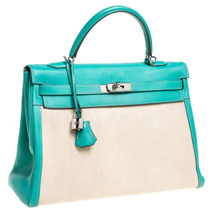 Pre Owned Hermes Lagon Toile and Swift Leather Palladium Hardware Kelly Retourne 35 Bag
