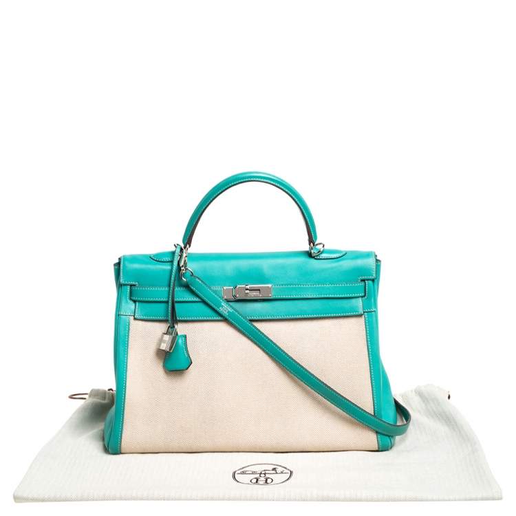 Pre Owned Hermes Lagon Toile and Swift Leather Palladium Hardware Kelly Retourne 35 Bag