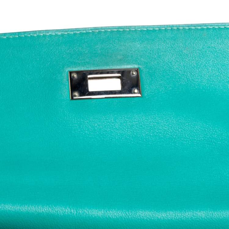 Pre Owned Hermes Lagon Toile and Swift Leather Palladium Hardware Kelly Retourne 35 Bag