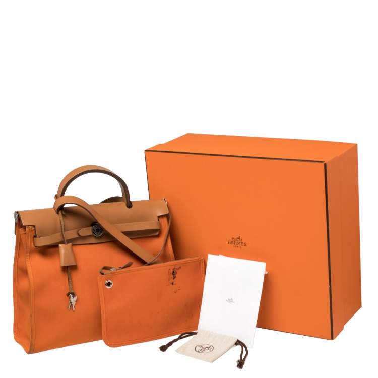 Pre Owned Hermes Orange/Natural Canvas and Leather Herbag Zip 31 Bag