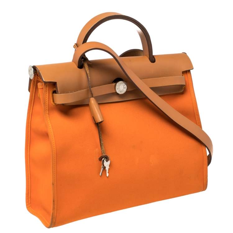 Pre Owned Hermes Orange/Natural Canvas and Leather Herbag Zip 31 Bag