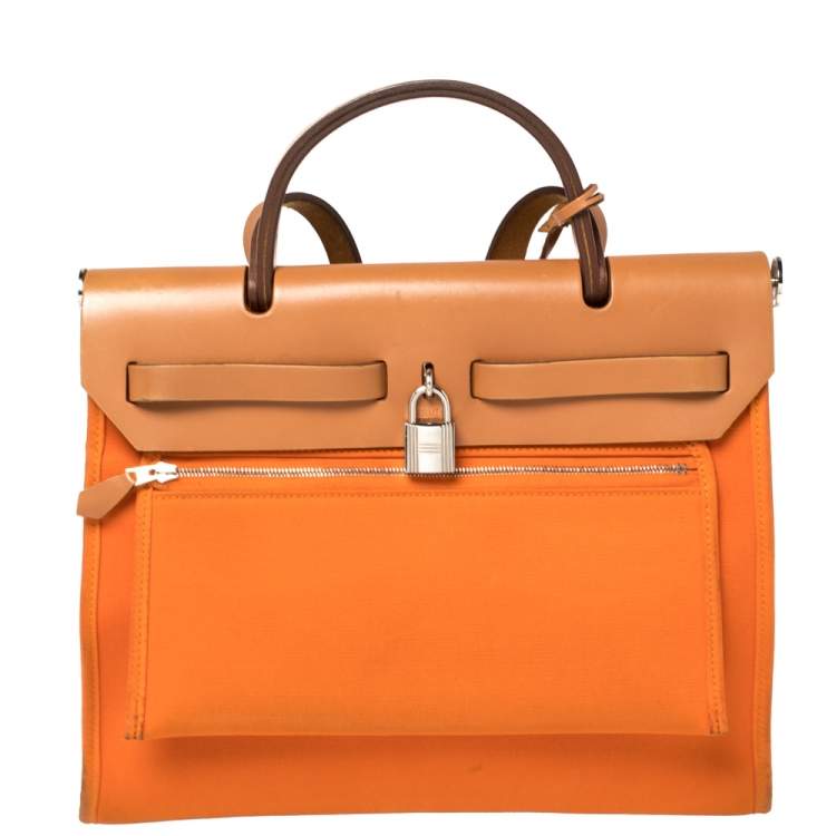 Pre Owned Hermes Orange/Natural Canvas and Leather Herbag Zip 31 Bag