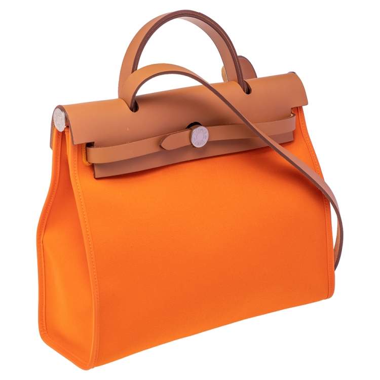 Pre Owned Hermes Orange/Natural Canvas and Leather Herbag Zip 31 Bag