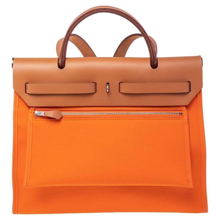 Pre Owned Hermes Orange/Natural Canvas and Leather Herbag Zip 31 Bag