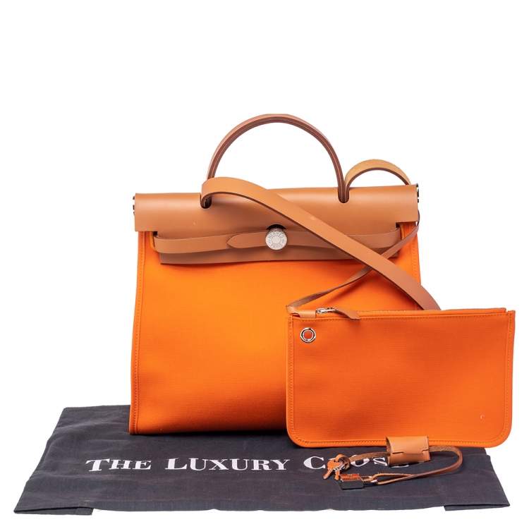 Pre Owned Hermes Orange/Natural Canvas and Leather Herbag Zip 31 Bag