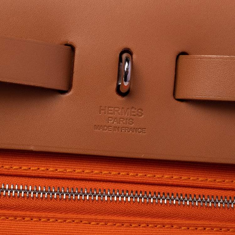 Pre Owned Hermes Orange/Natural Canvas and Leather Herbag Zip 31 Bag