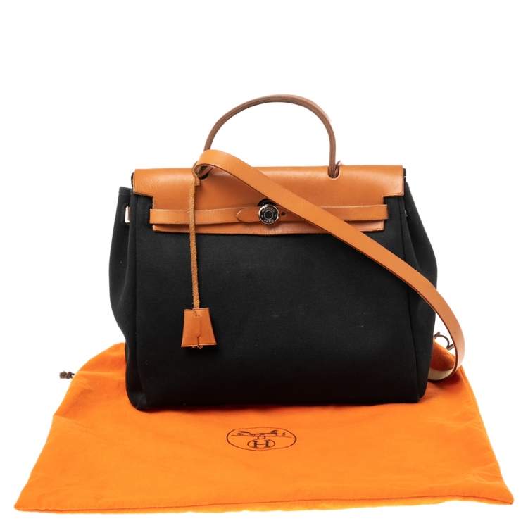 مملوكة مسبقًا Hermes Noir/Natural Canvas and Leather Herbag PM Bag