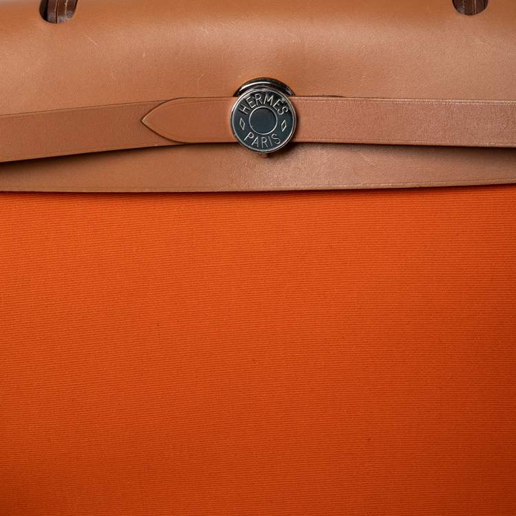 مملوكة مسبقًا Hermes Orange/Natural Canvas and Leather Herbag Zip PM Bag