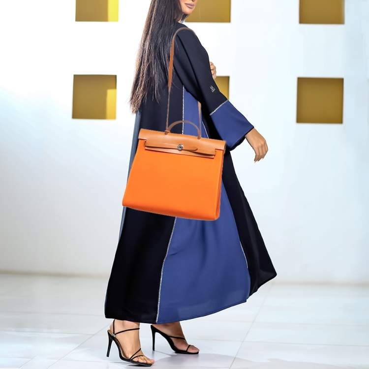 Pre Owned Hermés Orange/Natural Canvas and Leather Herbag Zip 39 Bag