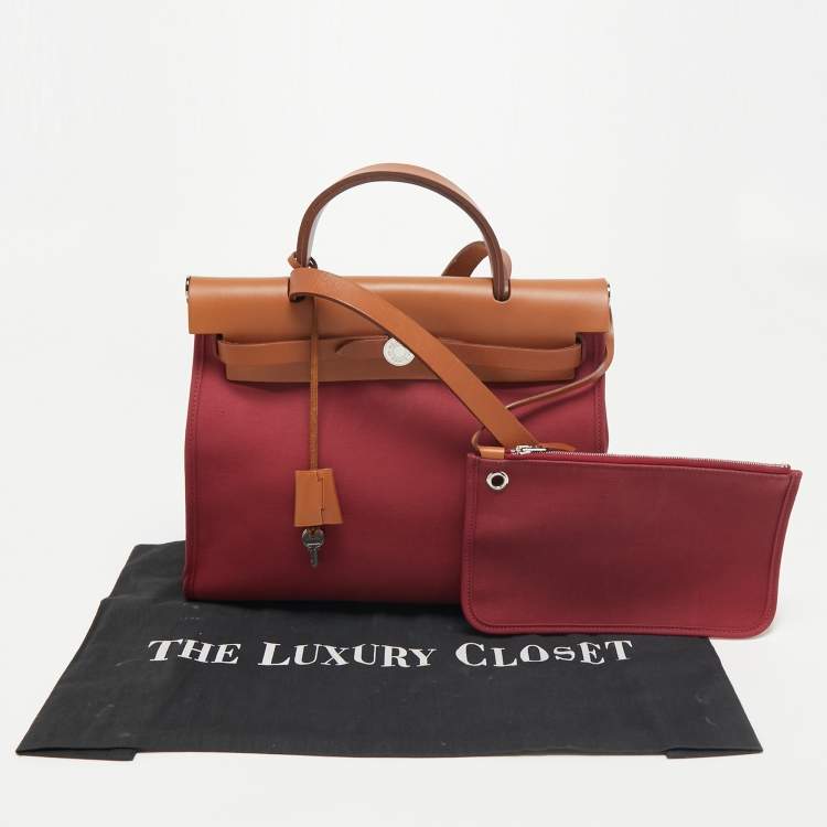 Pre Owned Hermes Ruby/Fauve Canvas and Leather Herbag Zip 31 Bag